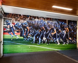 Custom football mural in Villanova University's athletic building.