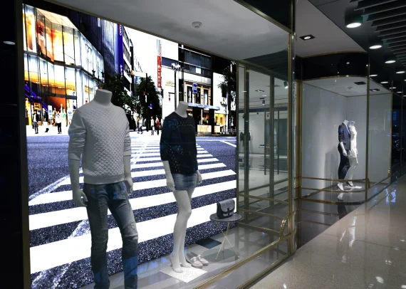 Backlit SEG fabric light box in a retail window display, printed by Color Reflections