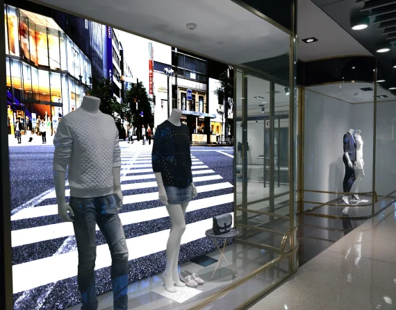 Backlit SEG fabric light box in a retail window display, printed by Color Reflections