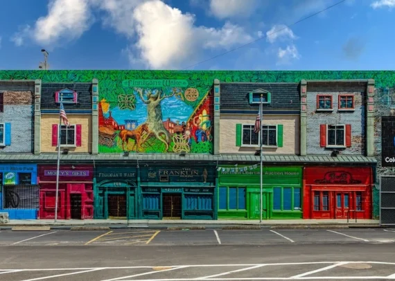 Building-scale exterior graphic on the Color Reflections building in Philadelphia, reproducing the historic Spring Garden Street storefronts in Northern Liberties